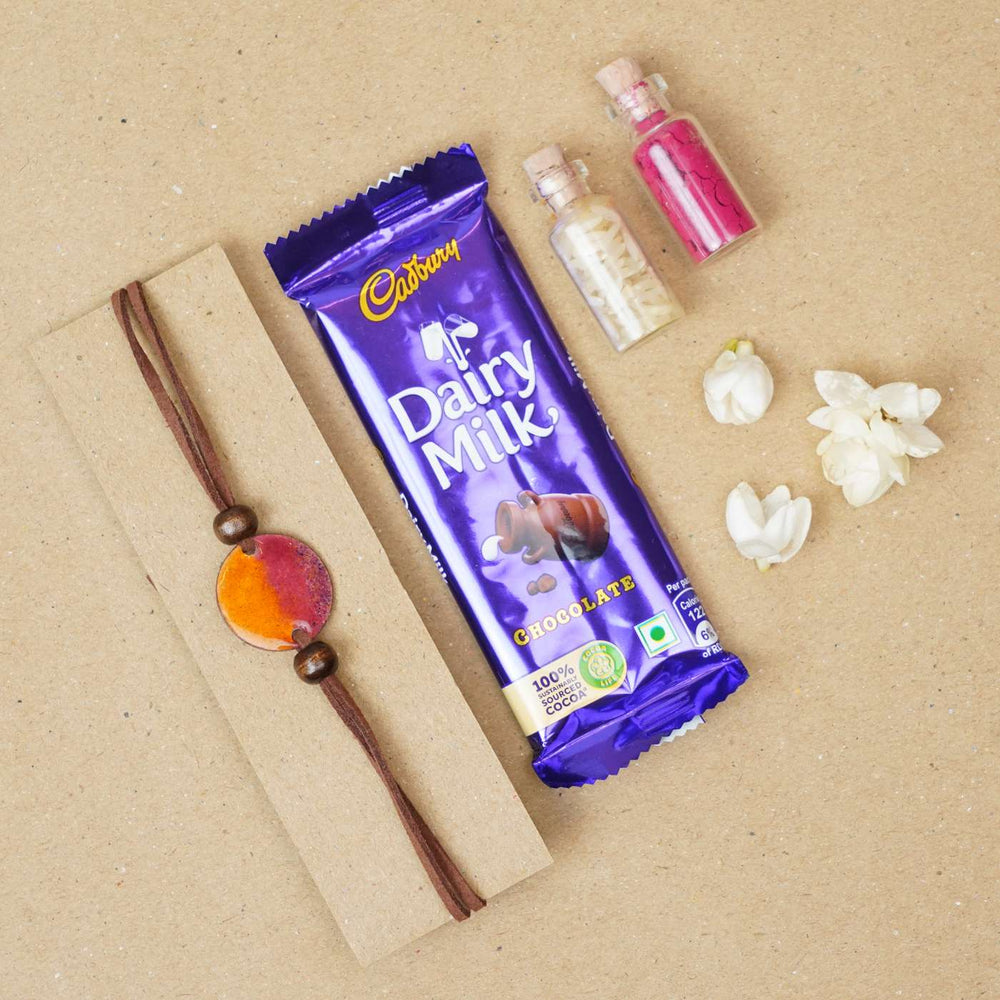 Handmade Ambar Yellow Copper Enamel Rakhi With Chocolates And Roli Chawal - Bracelet with chocolate gift set