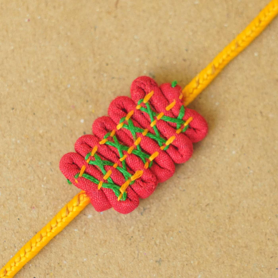 Handmade Dor Upcycled Fabric Rakhi With Roli Chawal - Close-up of knot design