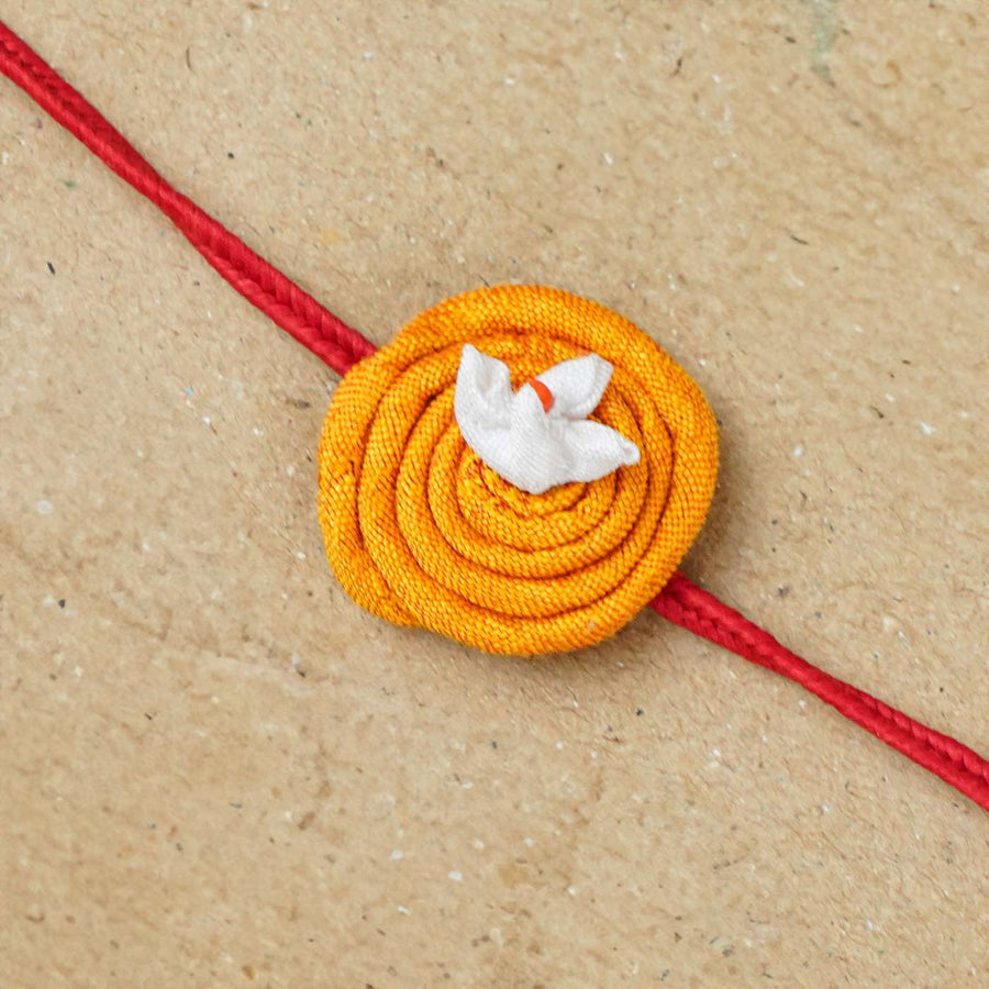 Handmade Rangoli Upcycled Fabric Rakhi With Roli Chawal - Close-up of Rakhi Thread Detail
