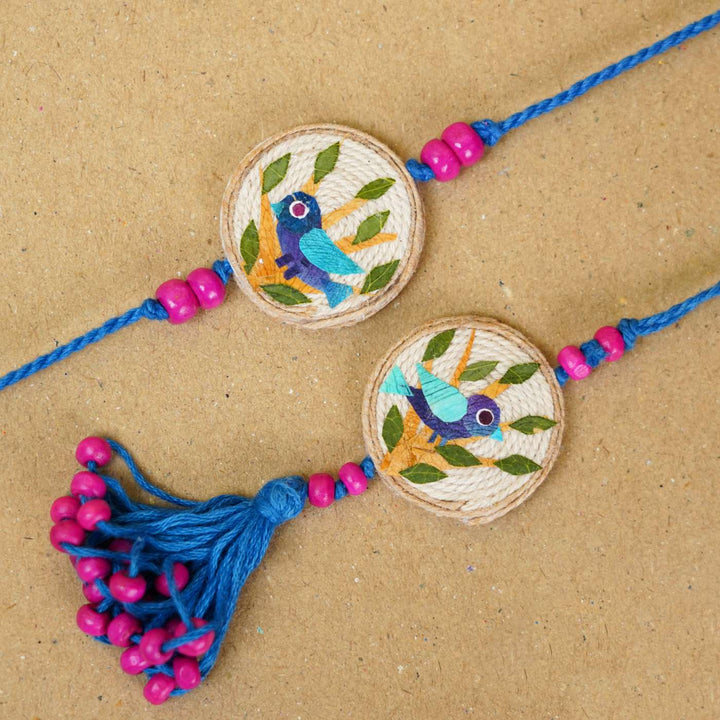 Handmade Pressed Flower Art Bluebird Jute Bhaiya Bhabhi Rakhi With Roli Chawal Set Of 2 - Close-up of bird design rakhis