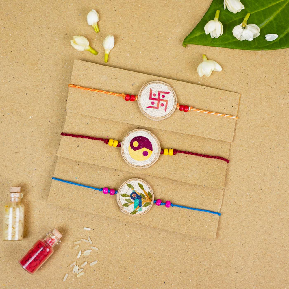 Handmade Pressed Flower Art Multi Colours Jute Rakhi With Roli Chawal Set Of 3 - Bracelets on display card