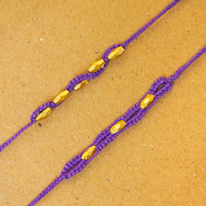 Handmade Macrame Beaded Rakhi With Roli Chawal Set Of 2 - Close-up of purple pair