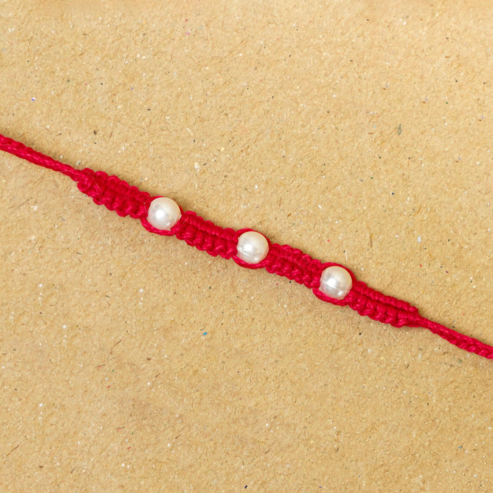 Handmade Macrame Three Pearl Rakhi With Roli Chawal - Close-up Front View (21)