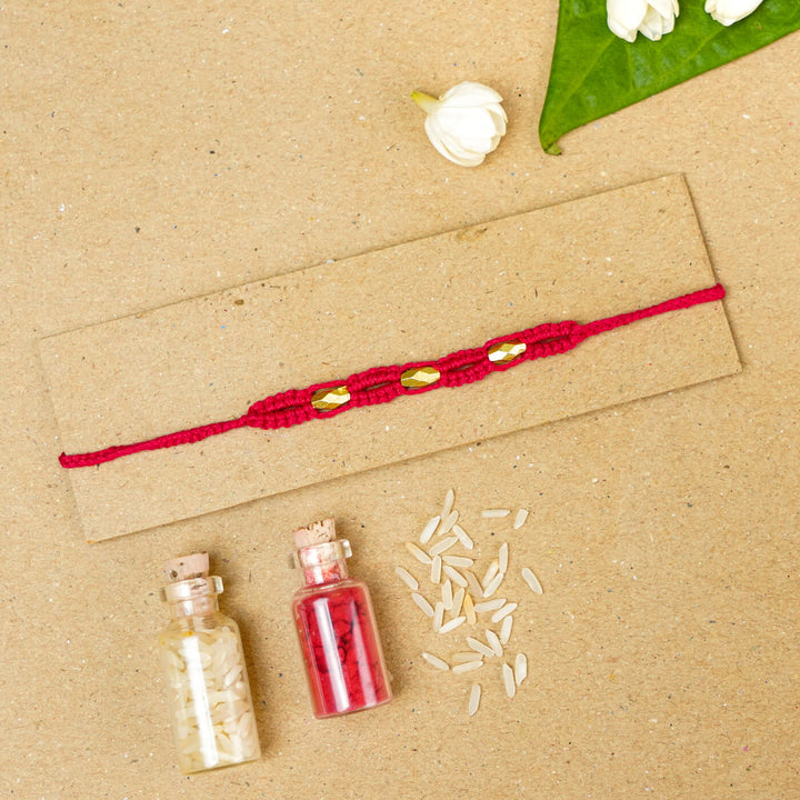 Handmade Macrame Three Gold Beaded Rakhi With Roli Chawal - Displayed on Card with Props (22)