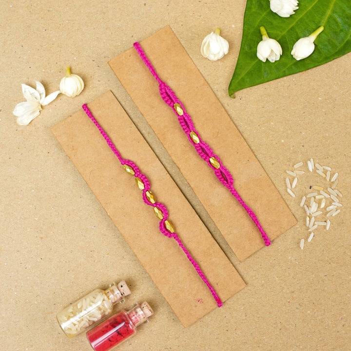 Handmade Macrame Beaded Rakhi With Roli Chawal Set Of 2 - Pink pair on card with decor