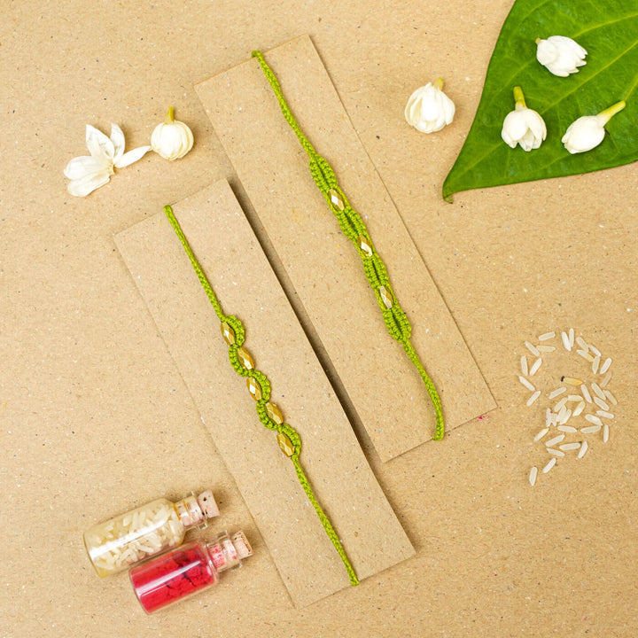 Handmade Macrame Beaded Rakhi With Roli Chawal Set Of 2 - Green pair on card with decor
