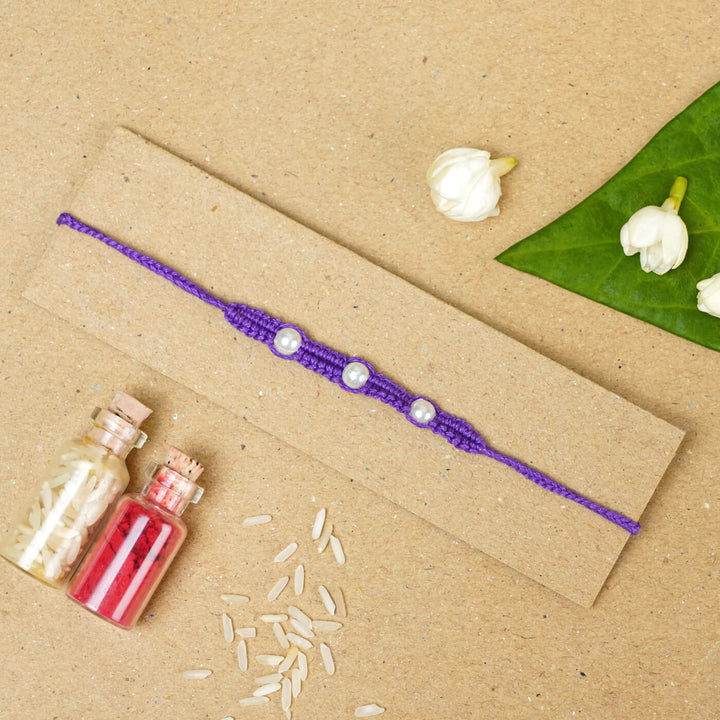 Handmade Macrame Three Pearl Rakhi With Roli Chawal - Flat Lay with Decorative Items (18)
