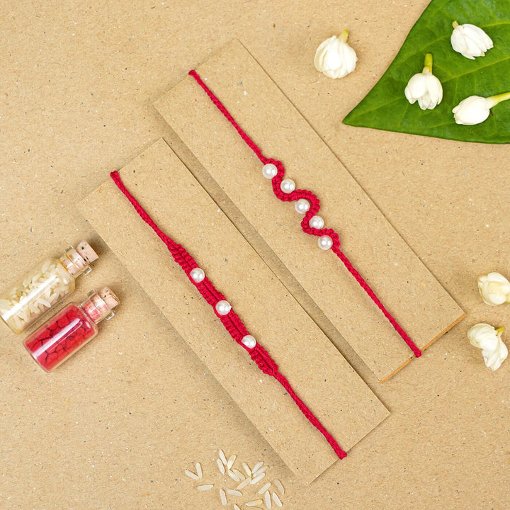 Handmade Macrame Beaded Rakhi With Roli Chawal Set Of 2 - Red pair on card with pearls