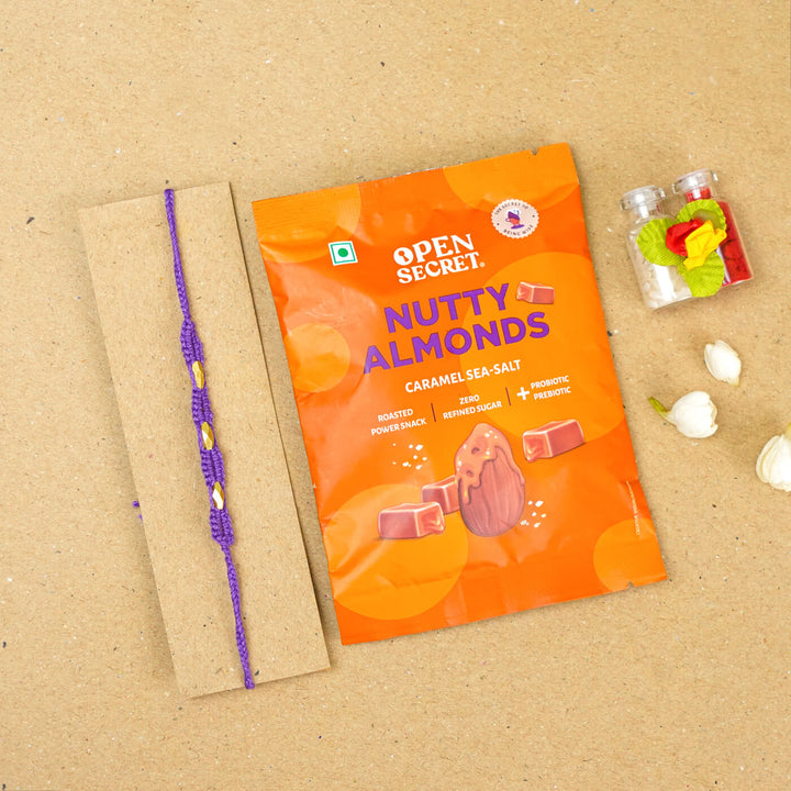 Handmade Macrame Three Gold Beaded Rakhi With Roli Chawal - Displayed on Card with Packaged Snack (20)