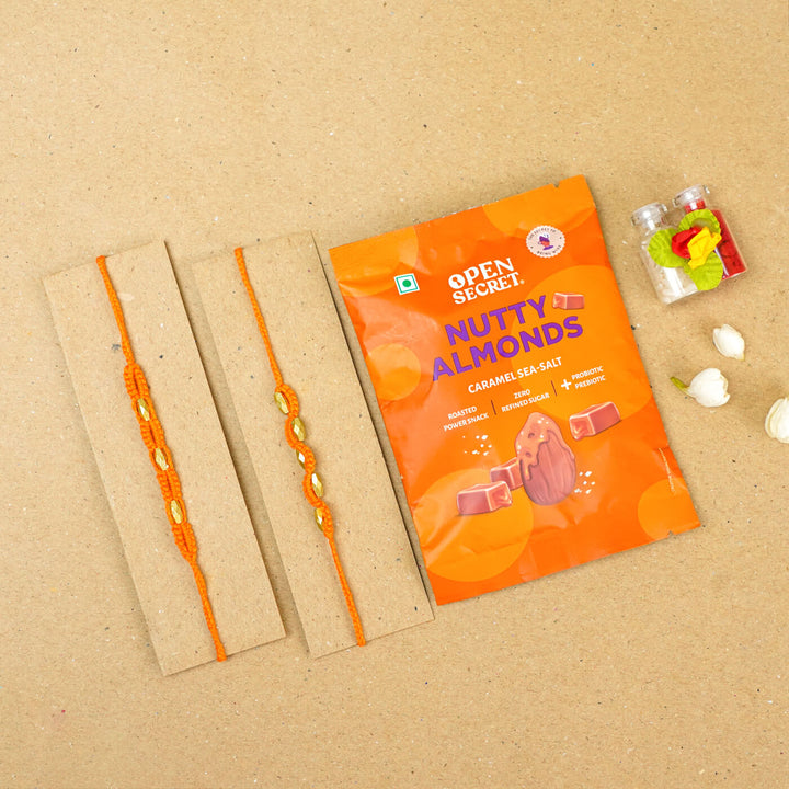 Handmade Macrame Beaded Rakhi With Roli Chawal Set Of 2 - Orange pair with packaging