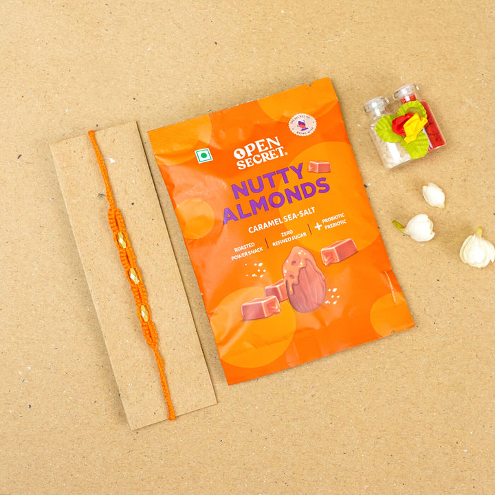 Handmade Macrame Three Gold Beaded Rakhi With Roli Chawal - Displayed on Card with Packaged Snack (12)