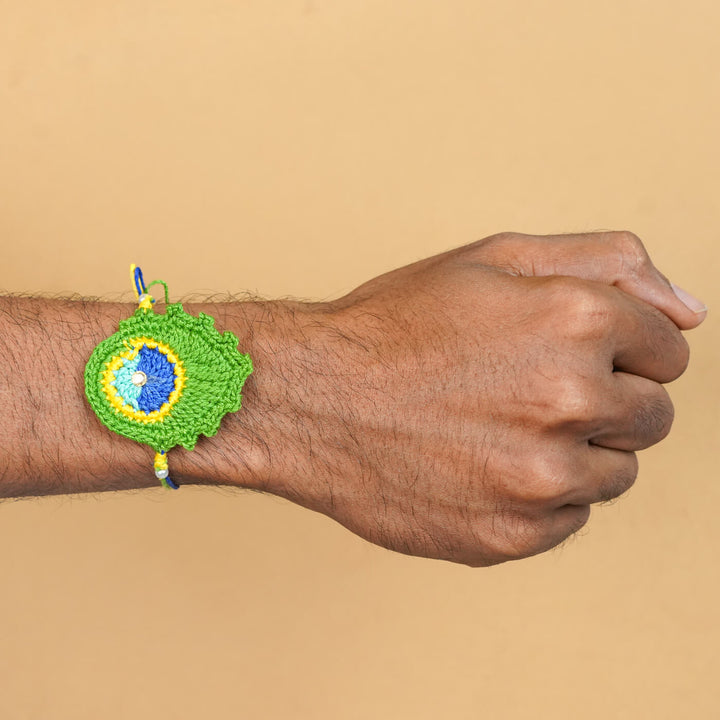 Handmade Crochet Peacock Feather Cotton Rakhi With Roli Chawal - Worn on Wrist