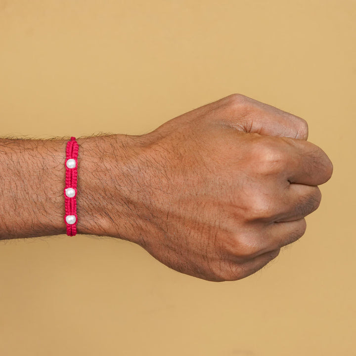 Handmade Macrame Three Pearl Rakhi With Roli Chawal - On Wrist View (24)