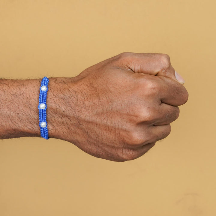 Handmade Macrame Three Pearl Rakhi With Roli Chawal - On Wrist View