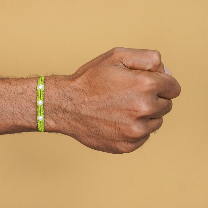 Handmade Macrame Three Pearl Rakhi With Roli Chawal - On Wrist View (8)