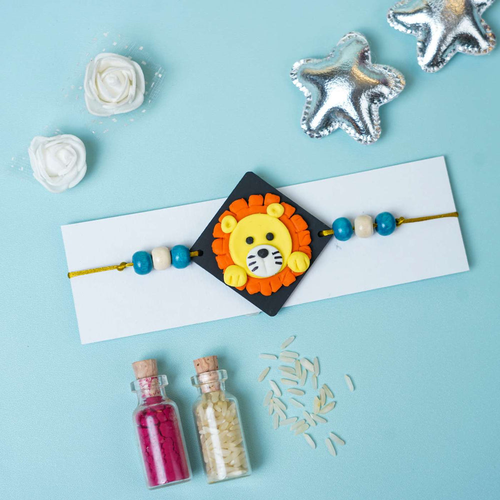 Handmade Miniature Clay Lion Themed Kids Rakhi With Roli Chawal - Rakhi on Display Card with Decor
