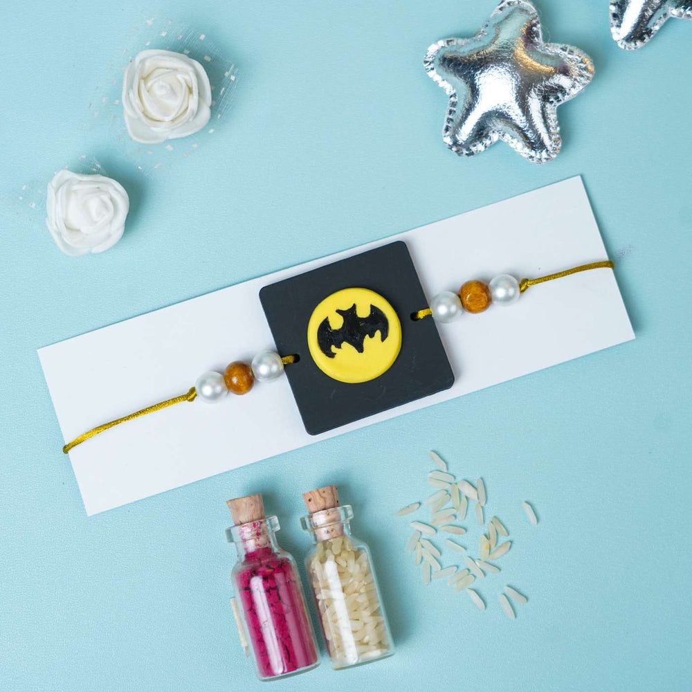 Handmade Miniature Clay Batman Kids Rakhi With Roli Chawal - Styled on Cardboard Display