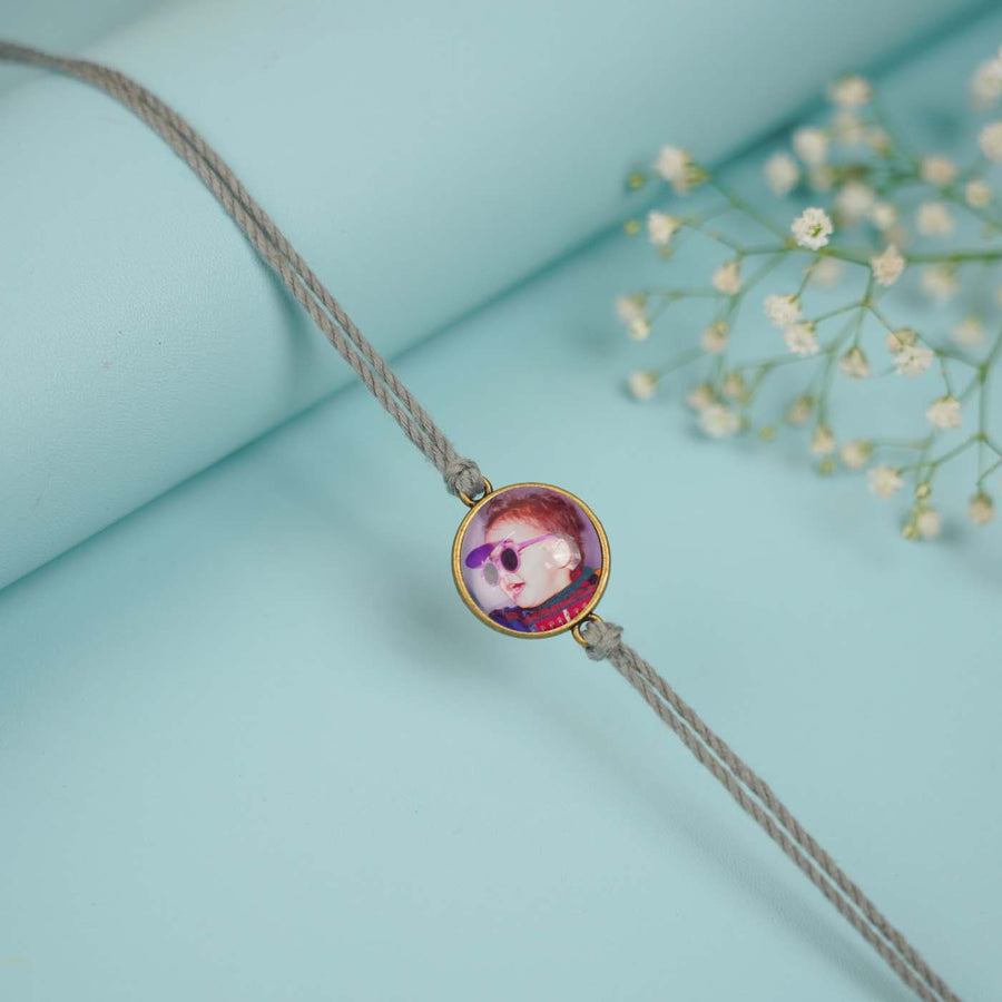 Photo Personalized Handmade Circle Antique Bronze Rakhi With Roli Chawal - Close-up of Single Bracelet