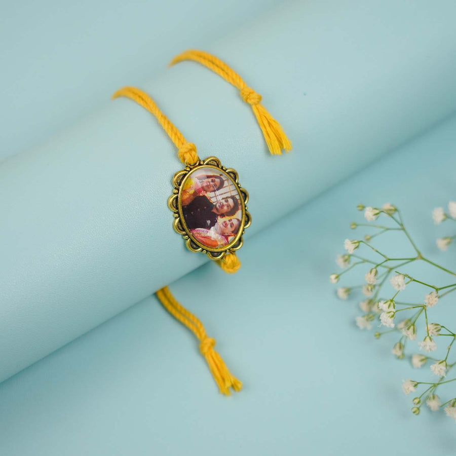 Photo Personalized Handmade Oval Antique Gold Rakhi With Roli Chawal - Close-up of Photo Frame Charm
