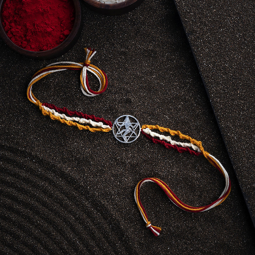 Handmade Bhairav 925 Silver Rakhi With Roli Chawal For Brother - Full View on Textured Surface