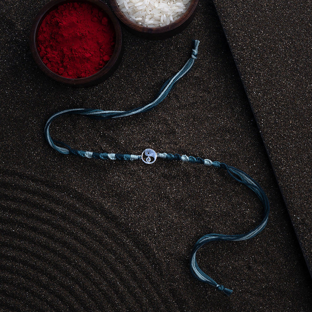 Handmade Gajanana 925 Silver Rakhi With Roli Chawal For Brother - Styled Product with Props and Background