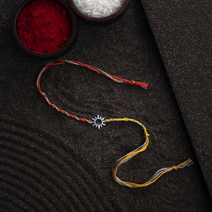 Handmade Aditya 925 Silver Rakhi With Roli Chawal For Brother - Full view with festive background