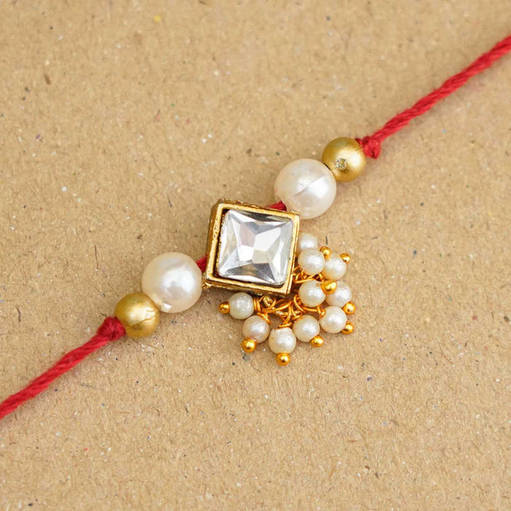 Handmade Kundan Diamond Shape Rakhi With Roli Chawal - Close-up of central decorative element