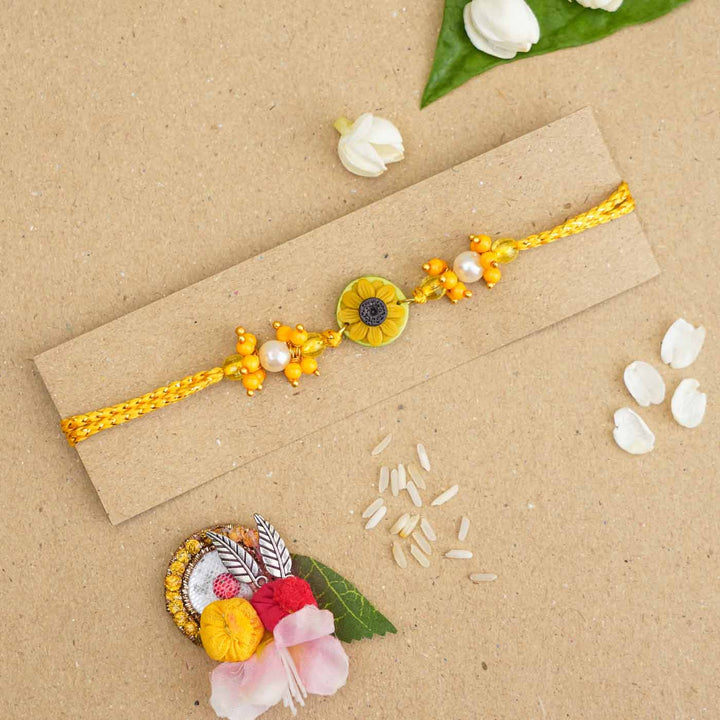 Handmade Miniature Clay Sunflower Rakhi With Roli Chawal - Bracelet on Display Card