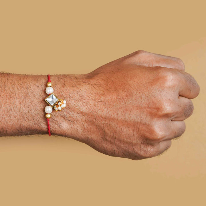 Handmade Kundan Diamond Shape Rakhi With Roli Chawal - Wrist wear demonstration