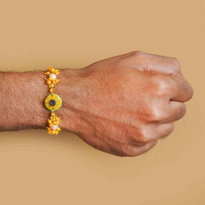 Handmade Miniature Clay Sunflower Rakhi With Roli Chawal - Worn on Wrist