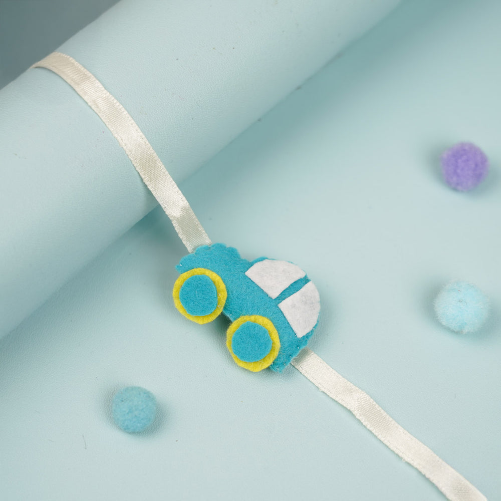 Handmade Teal Blue Car Theme Felt Kids Rakhi - Ribbon Wrapped Around Cylinder Display