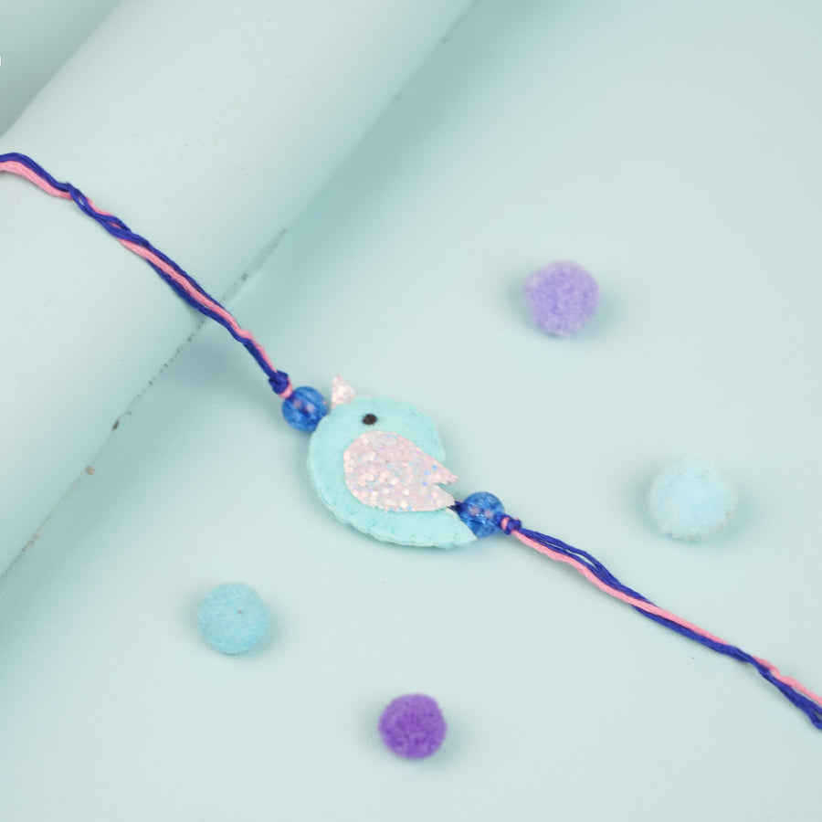 Handmade Blue Bird Theme Felt Kids Rakhi - Close-up of Bird Charm Bracelet