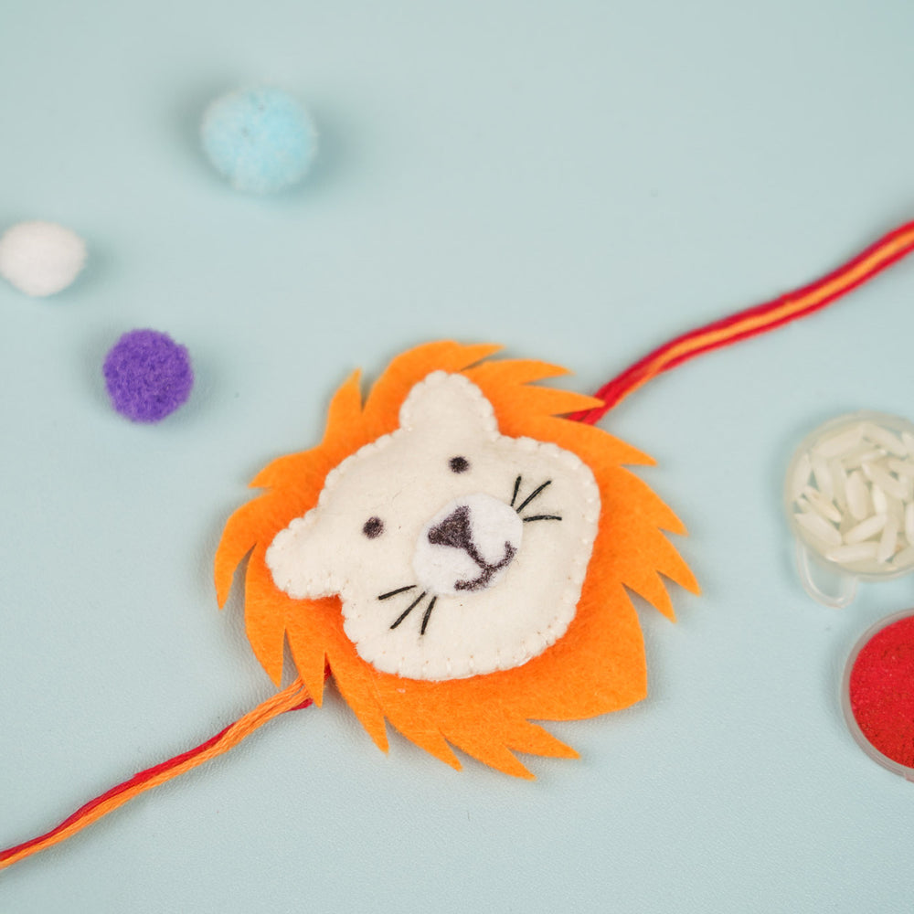Handmade Lion Theme Felt Kids Rakhi - Top View with Decorative Elements