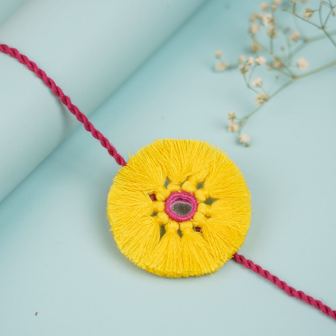 Handmade Pom Pom Design Fabric Rakhi For Brother - Close-up of Tassel Detail