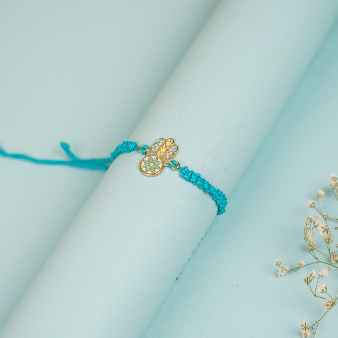 Handmade Hamsa Hand Design Metal Rakhi For Brother - Wrapped Around Cylinder Display