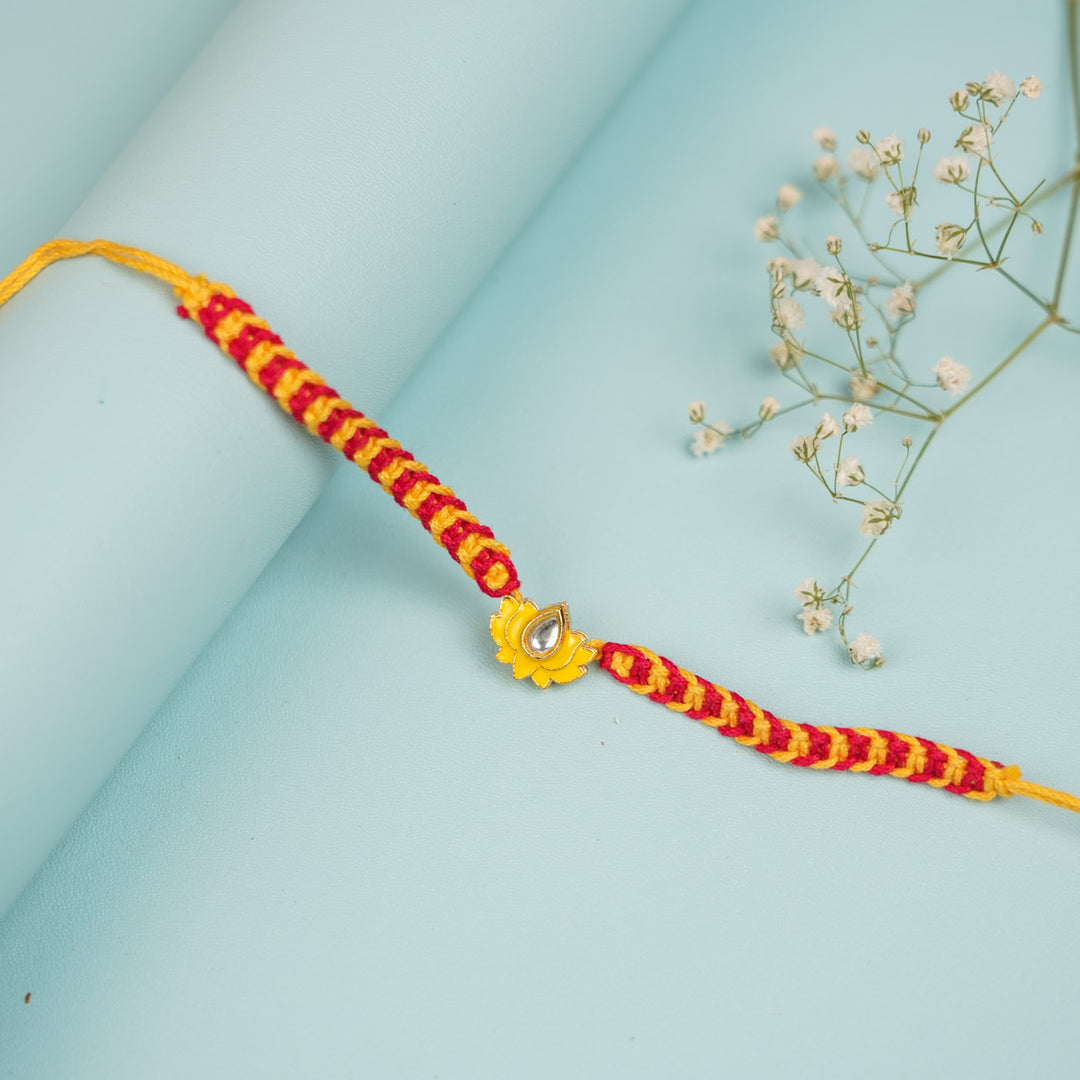 Handmade Kamala Design Metal Rakhi For Brother - Top View with Floral Accent