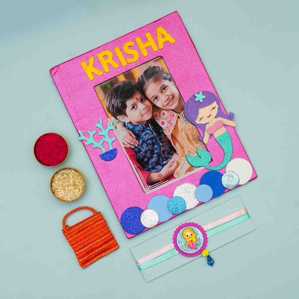 Personalized Handmade Mermaid Theme Felt Kids Rakhi And Photo Frame Combo For Sisters Set Of 2 - Flat Lay with Accessories