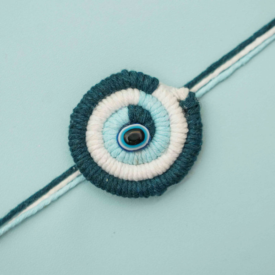 Handmade Macrame Evil Eye Design Cotton Kids Rakhi With Chocolates And Roli Chawal - Close-up of Rakhi design