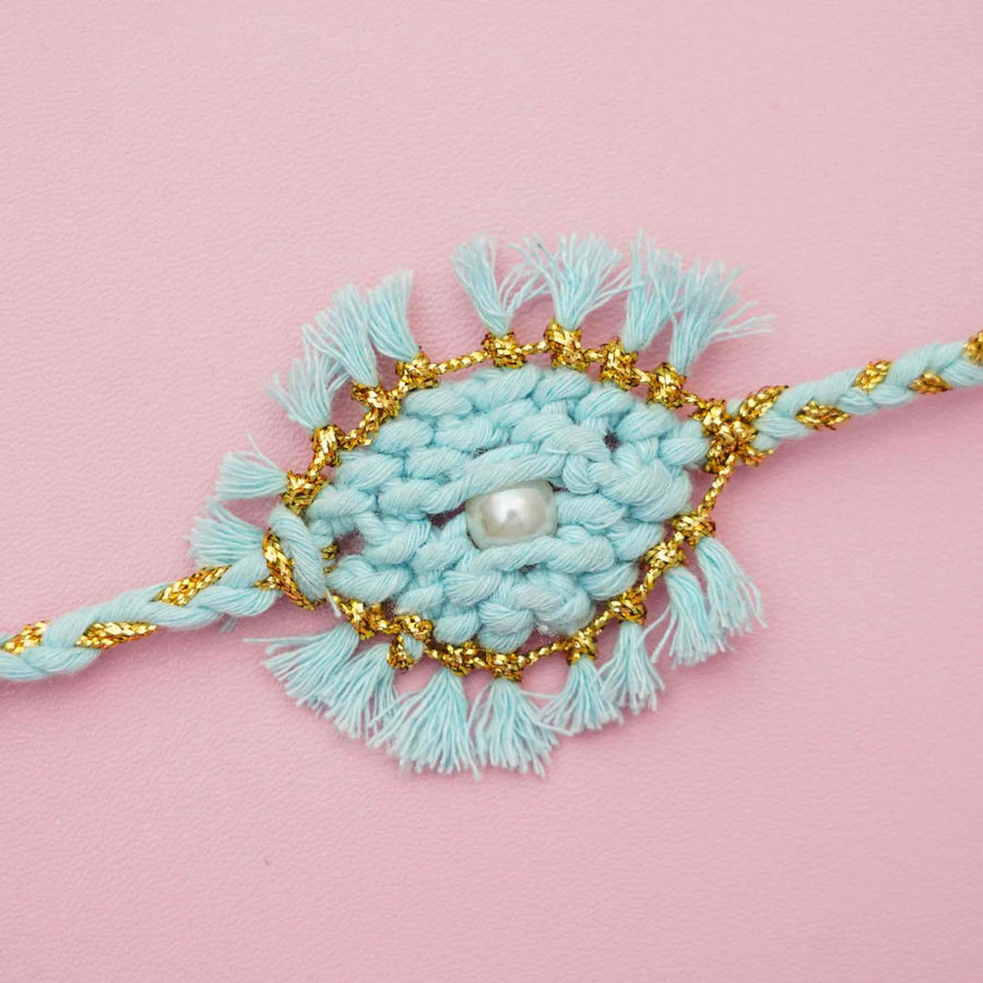 Handmade Macrame Pearl Evil Eye Design Cotton Kids Rakhi With Chocolates And Roli Chawal - Close-up of Bracelet Detail