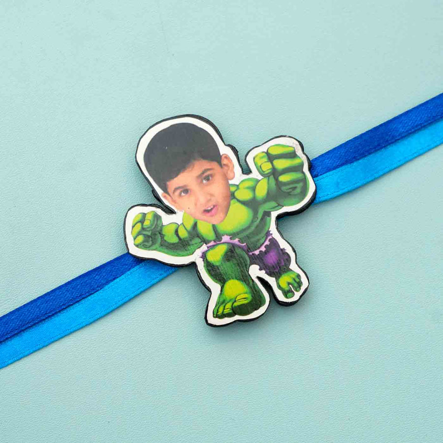 Photo Personalized Reusable X Large Hulk Mdf Wood Rakhi With Chocolates And Roli Chawal - Close-up of Character on Ribbon