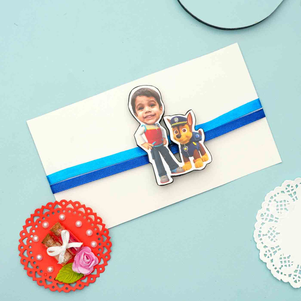 Photo Personalized Reusable X Large Paw Petrol Mdf Wood Rakhi With Chocolates And Roli Chawal - Magnet on gift envelope