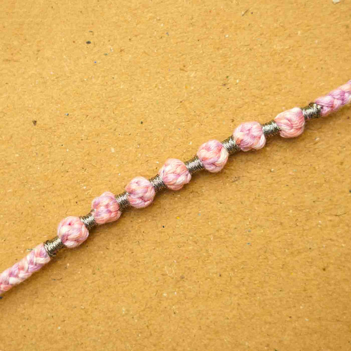 Reusable Beaded Pink Ombre Knot Rakhi With Roli Chawal - Close-up of beaded detail