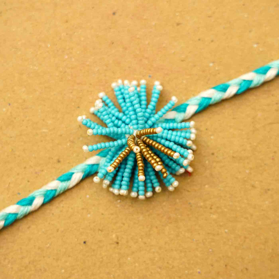 Reusable Beaded Blue Flower Rakhi With Roli Chawal - Beaded Knot Close-up
