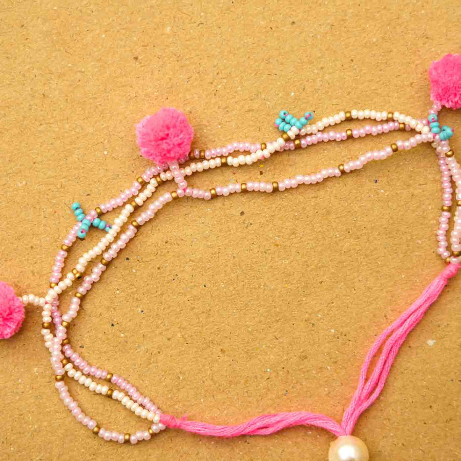 Reusable Beaded Tassel Lumba Rakhi For Bhabhi With Roli Chawal - Close-up of Threaded Bracelet