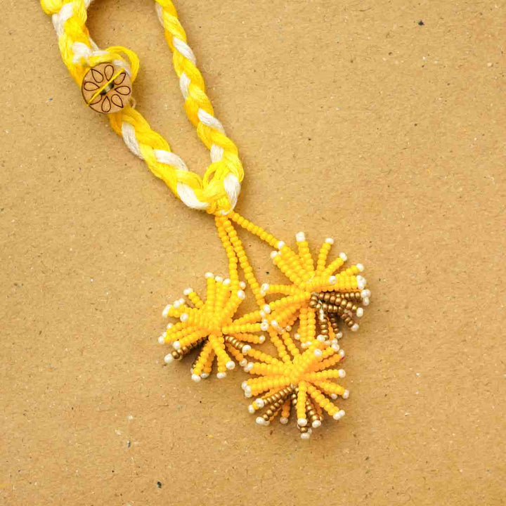 Reusable Beaded Yellow Flower Lumba Rakhi For Bhabhi With Roli Chawal - Close-up of Rakhi bead detailing
