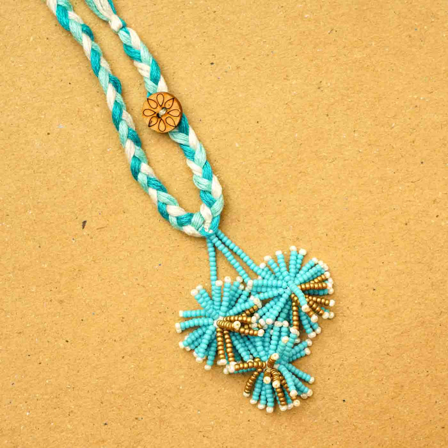 Reusable Beaded Blue Flower Lumba Rakhi For Bhabhi With Roli Chawal - Close-up of beaded tassels