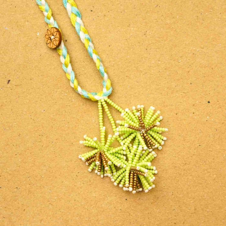 Reusable Beaded Green Flower Lumba Rakhi For Bhabhi With Roli Chawal - Close-up of Bead Details