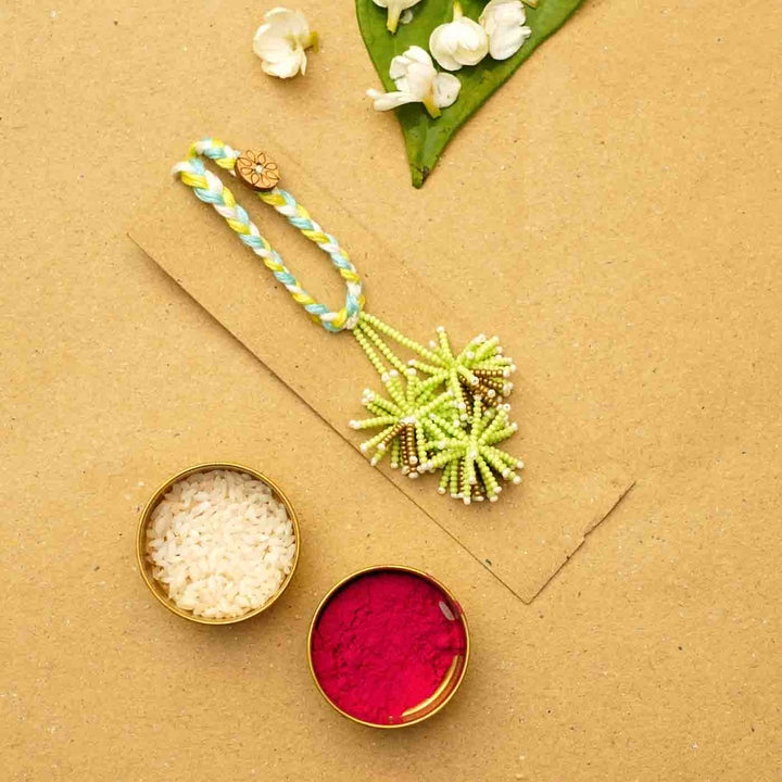 Reusable Beaded Green Flower Lumba Rakhi For Bhabhi With Roli Chawal - Decorative Setup with Accessories