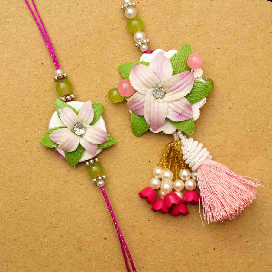 Handmade Lily Clay Bhaiya Bhabhi Rakhi With Chocolates And Roli Chawal Set Of 2 - Close-up Front View of Rakhi Set