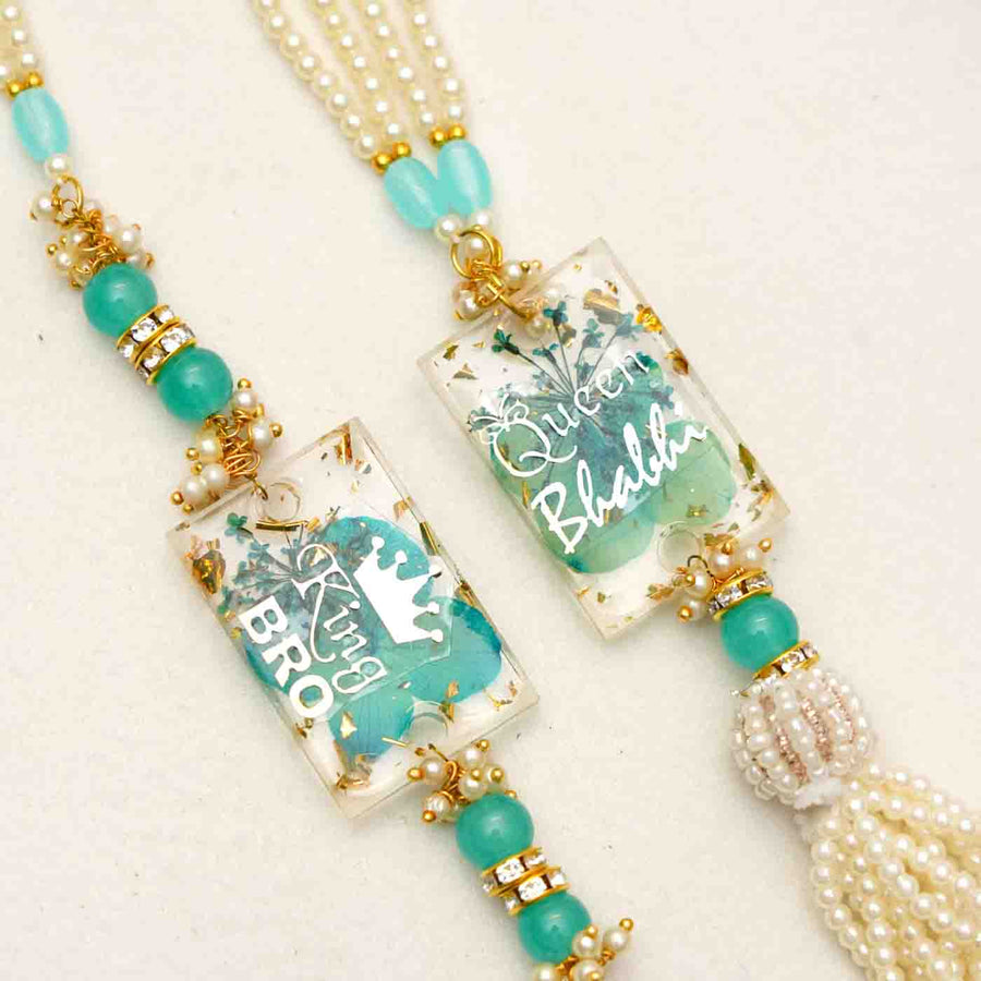 Handmade Resin Pyara Bhai And Pyari Bhabhi Rakhi With Chocolates And Roli Chawal Set Of 2 - Close-up of Pendant Charms